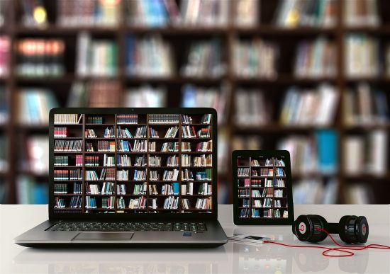 Laptop with books on the screen