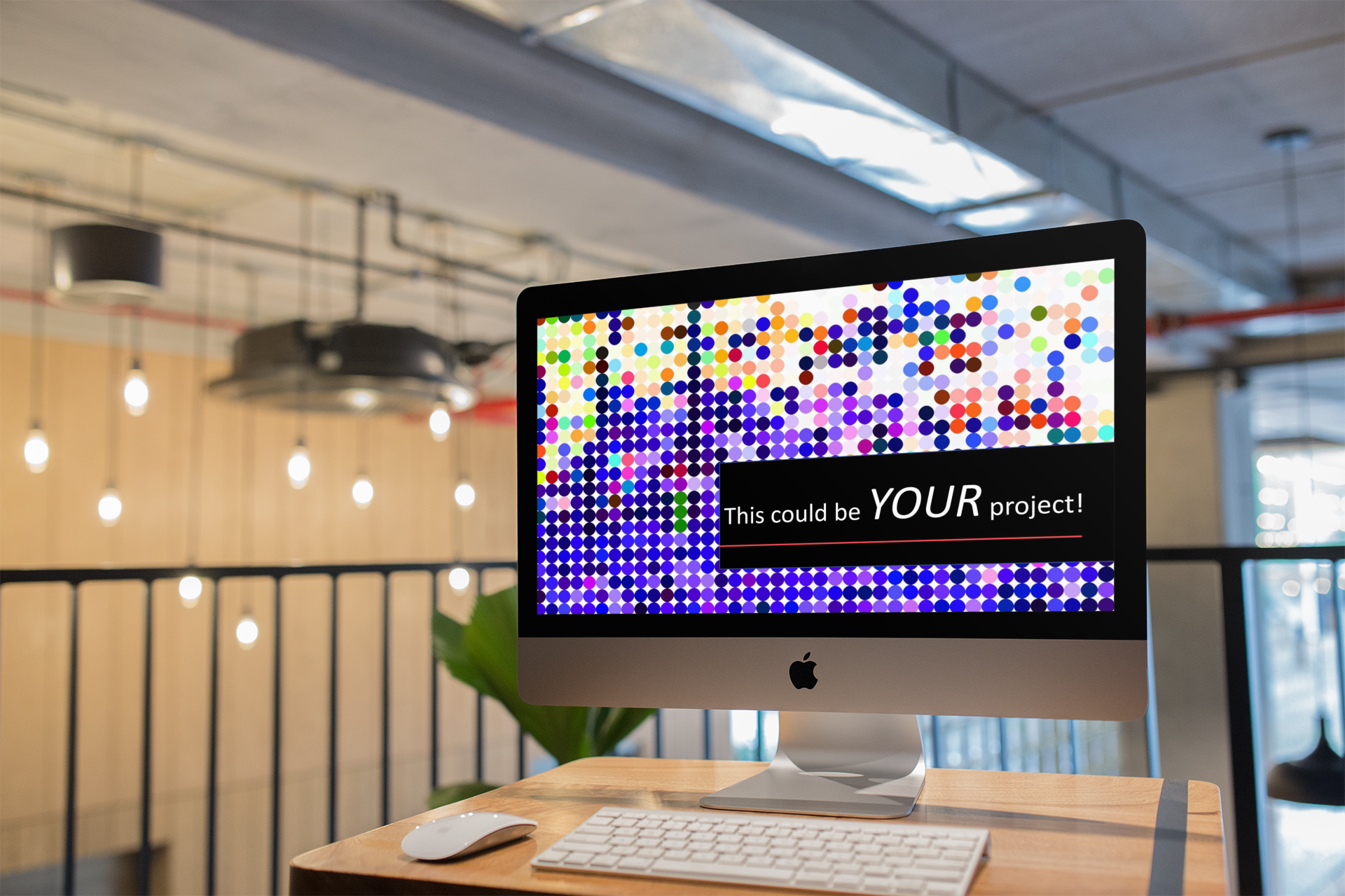imac with colourful and abstract image on screen on a table